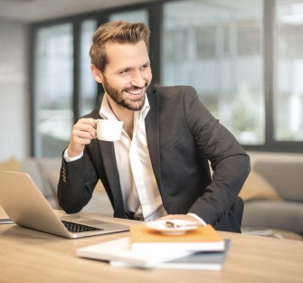 gallery/man-holding-white-teacup-in-front-of-gray-laptop-842567